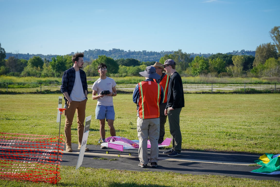 Skyler, Zach & Chase (left→right) chatting with competition officials.