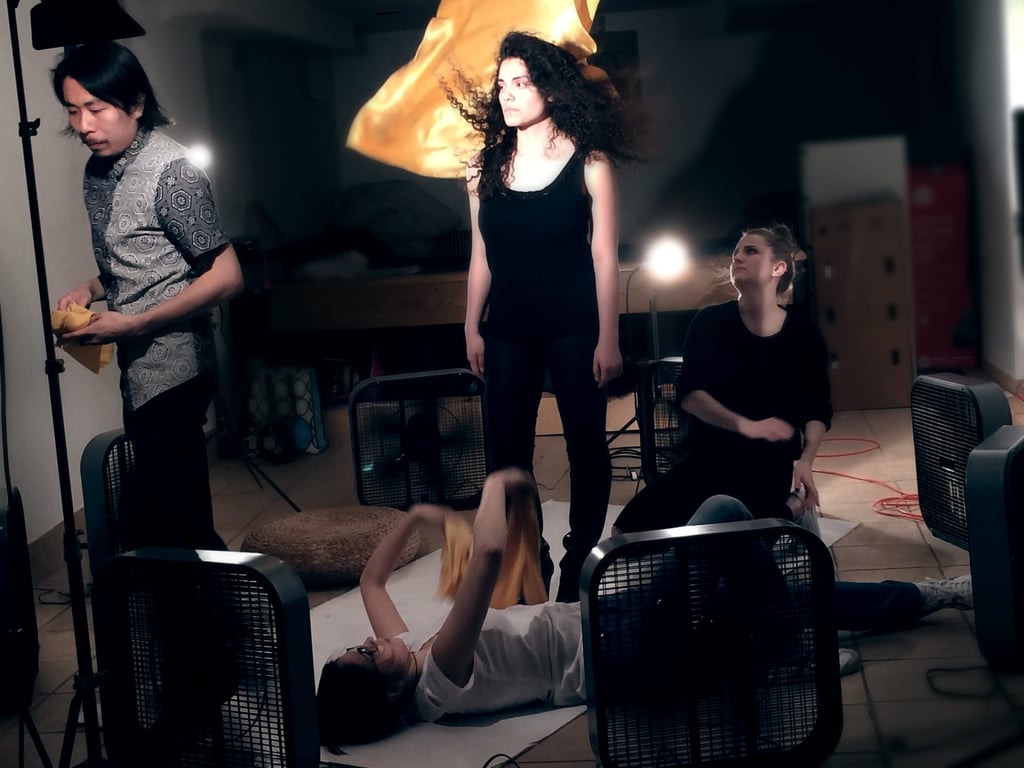 Outside of the frame, the crew assisted with the placements of flowing silk pieces