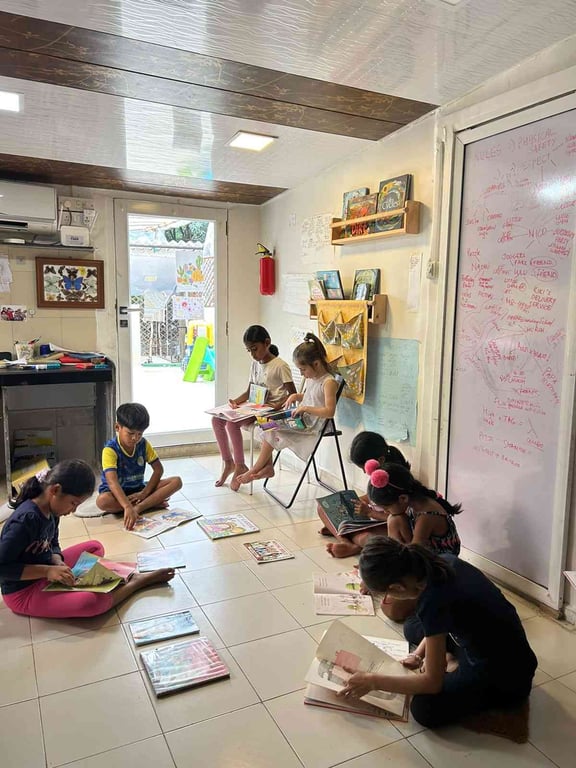 Literacy classes like this have resulted in 8 year olds learning to read fluently (and for pleasure). No desks, no exams.