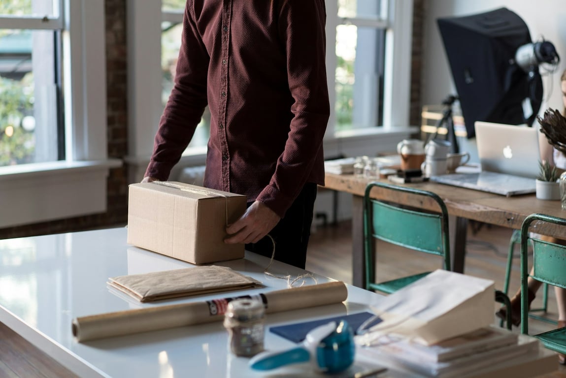 QuickBooks ShipStation invoice integration: packing an invoiced order for shipment. Photo by Bench Accounting on Unsplash