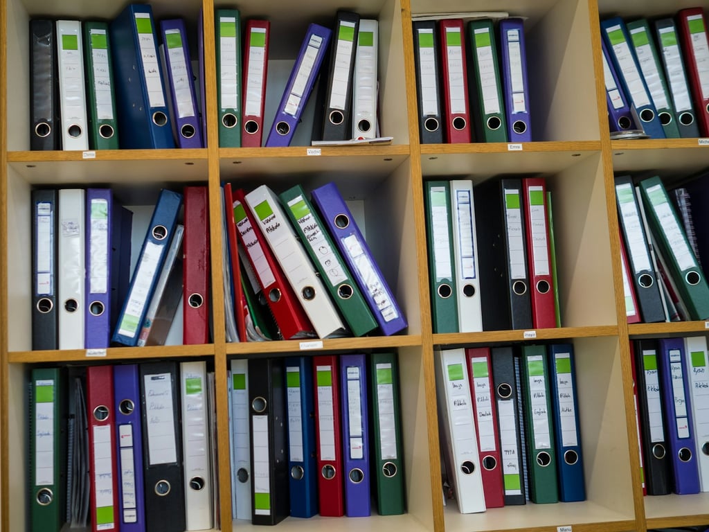 Managing Notion teamspaces and permissions works like a well-labeled filing system. Photo by Richard Heinen on Unsplash