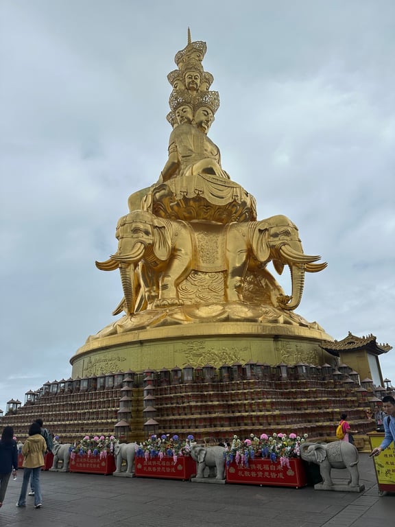 Samantabhadra in this statue is known for having 10 faces, and his elephants each have 6 tusks.