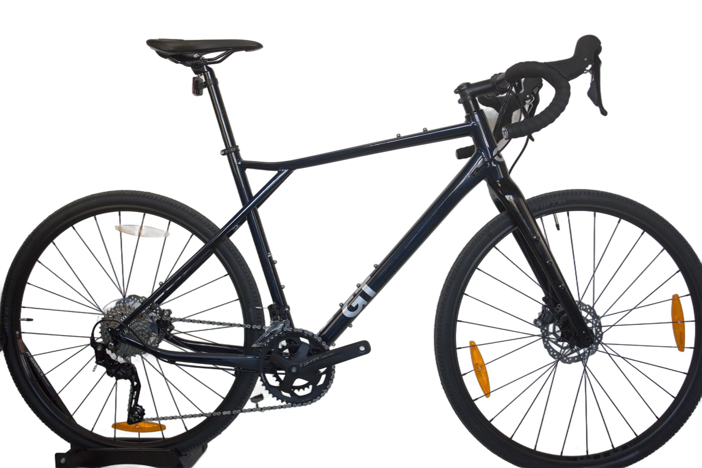 Mørk blå GT Grade Comp fra siden med landeveissykkeldesign.
