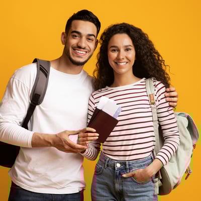 Students preparing for their next Blue Dot Tours adventure, holding passports and backpacks before an unforgettable learning experience overseas.
