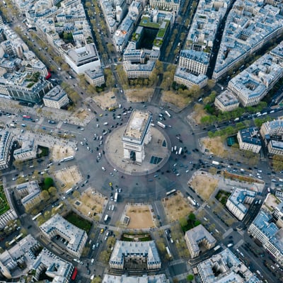 Aerial view of the Arc de Triomphe at the center of the Paris rotary with radiating boulevards