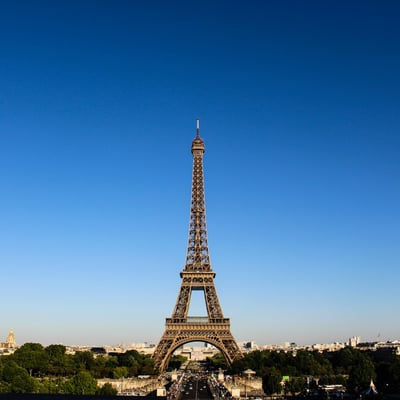 The Eiffel Tower rising into a clear blue Parisian sky