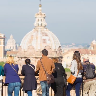 New group leaders looking out over Vatican City, symbolizing the confidence and preparation Blue Dot provides first-time tour leaders.