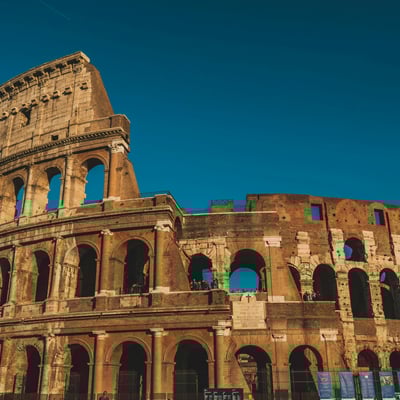 The ancient Roman Colosseum under dramatic skies in Rome