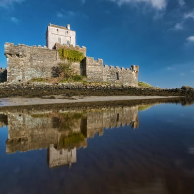 Stone walls and tower of Carrickfergus Castle on the Irish coast
