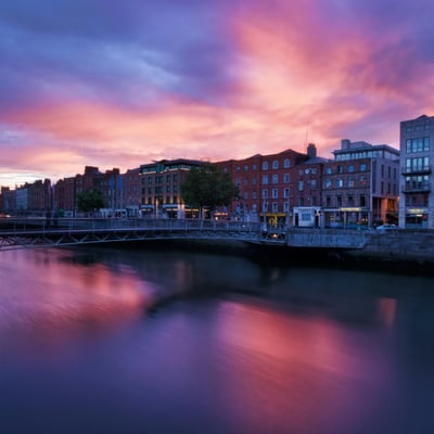 Reflections of bridges and buildings on the River Liffey in Dublin