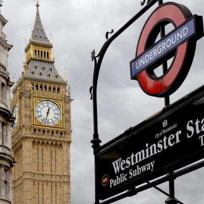 Big Ben clock tower with a red London Underground sign