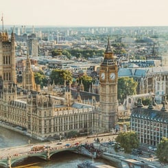 Icon of the Big Ben and the Houses of Parliament standing tall over the Thames on a clear day