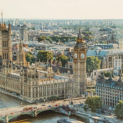 Big Ben and the Houses of Parliament standing tall over the Thames on a clear day