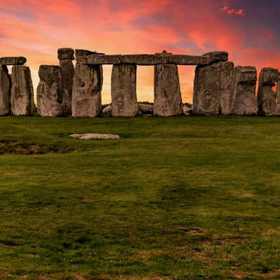Ancient Stonehenge monument beneath a cloudy sky