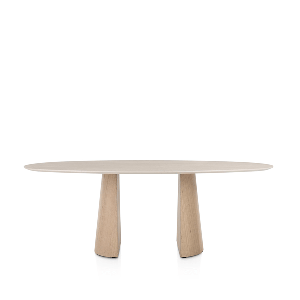 XOOON Aras eettafel met ovale travertinlook blad en eikenfineer conische poot in moderne woonruimte