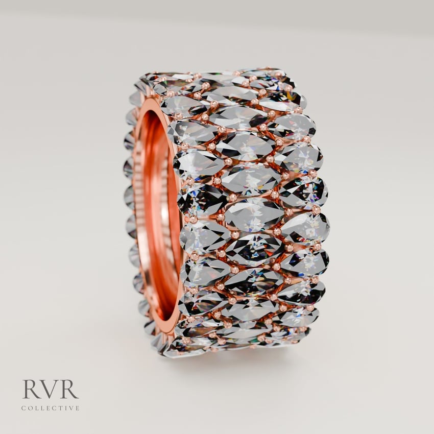 Pear and marquise stacking rings in rose gold, standing on edge