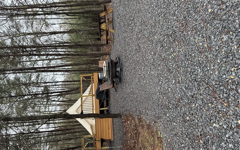 The living room with a fire pit in Great Cacapon, West Virginia