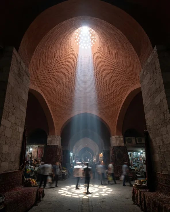Light shaft falling through a cone into the market