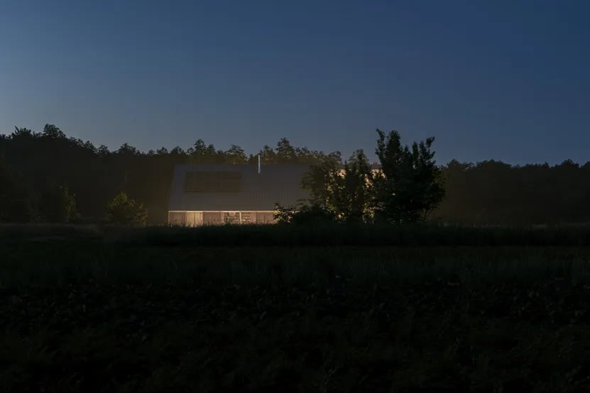 Dark rural house at dusk