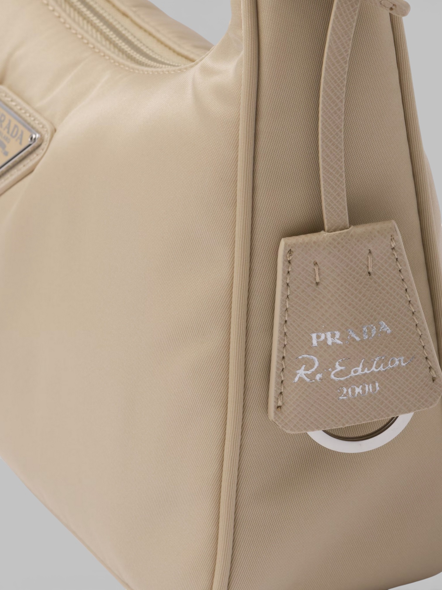Prada Prada Re-Edition 2000 Mini-Bag Warm Cream – detail view in premium quality with AA+ craftsmanship