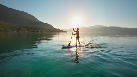 Paddleboarding Bliss on a Crystal Lake Desktop Preview