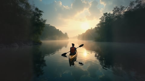 Serene Canoe Fishing on a Misty Lake Desktop Preview