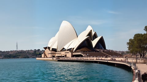 The Iconic Sydney Opera House Under a Bright Sunny Sky Desktop Preview