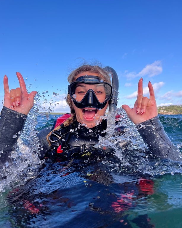Happy open-water students during their first course dives in Sydney