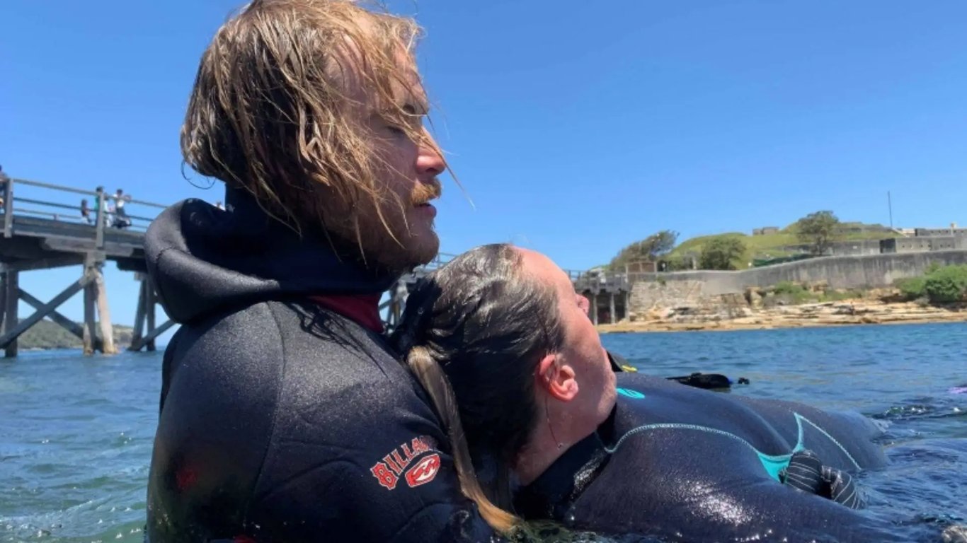 Students practising rescue techniques with an instructor