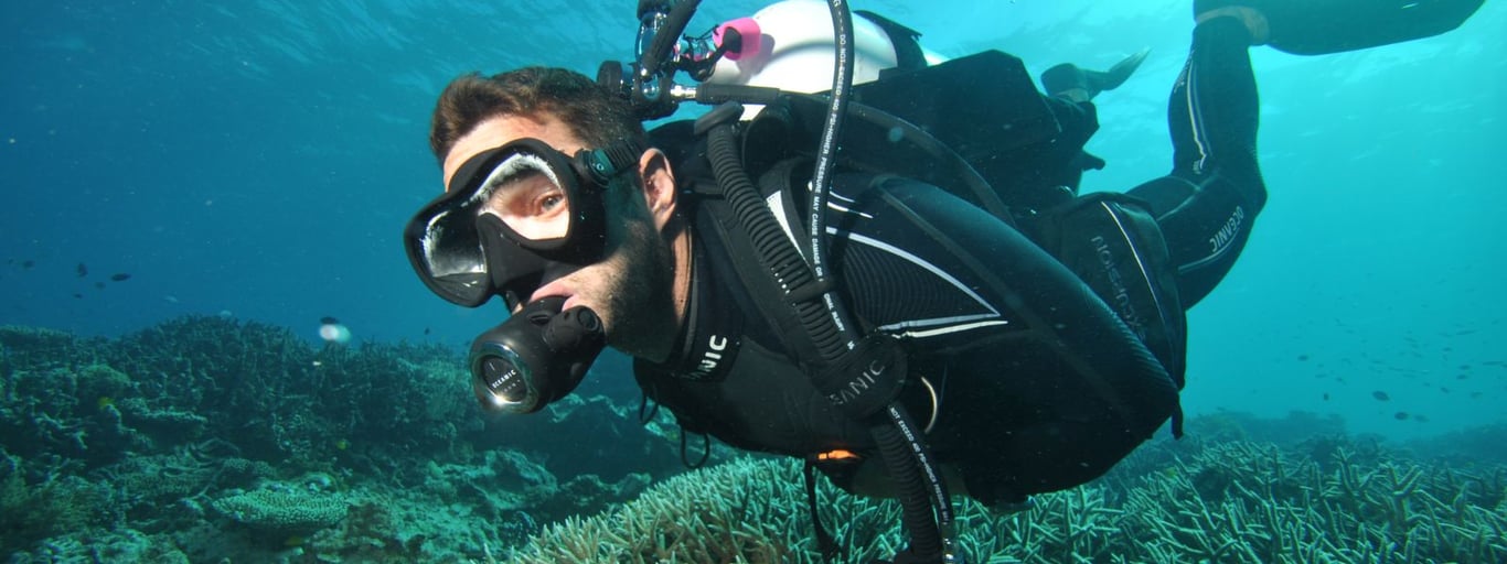 Scuba diver checking gear before water entry