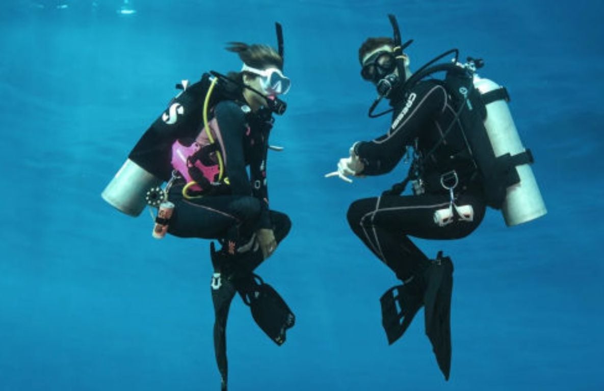 Advanced diver hovering effortlessly over a reef