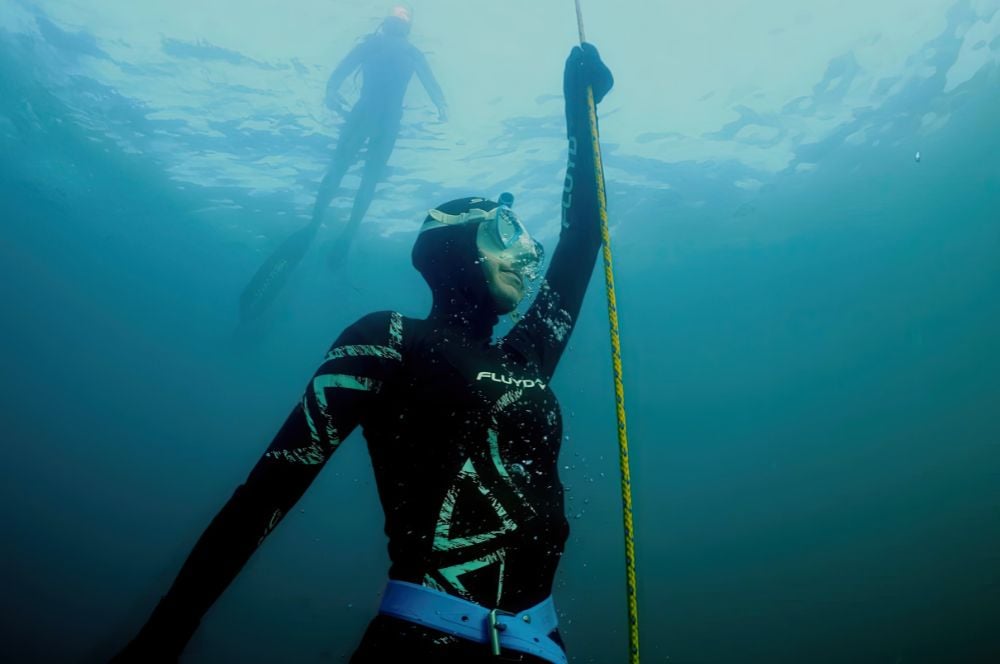 A freediver returning to the surface after a deep dive