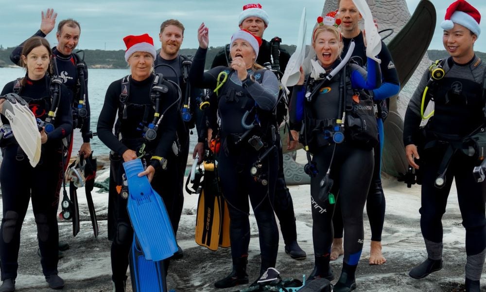 Members of the Abyss Scuba Diving Community engaging in a group dive, showcasing camaraderie before a Christmas dive.