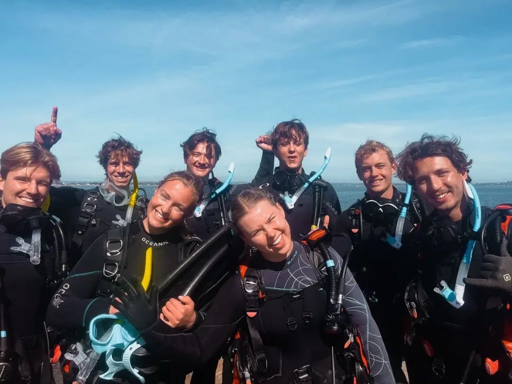 Group of new divers celebrating their certification