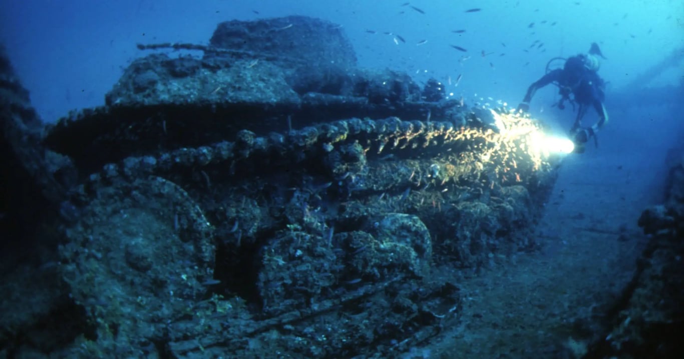 Truk Lagoon wreck and diver representing the January to April travel window