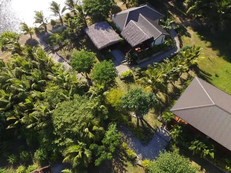 Aerial view of Vanuatu accommodation surrounded by tropical gardens