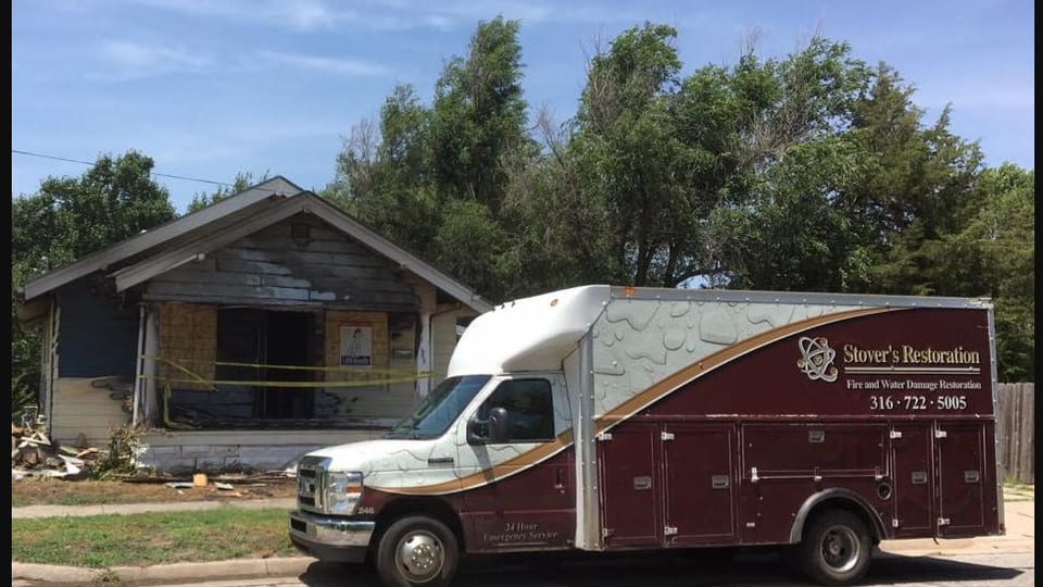 Stover’s Restoration vehicle at a fire-damaged Kansas property