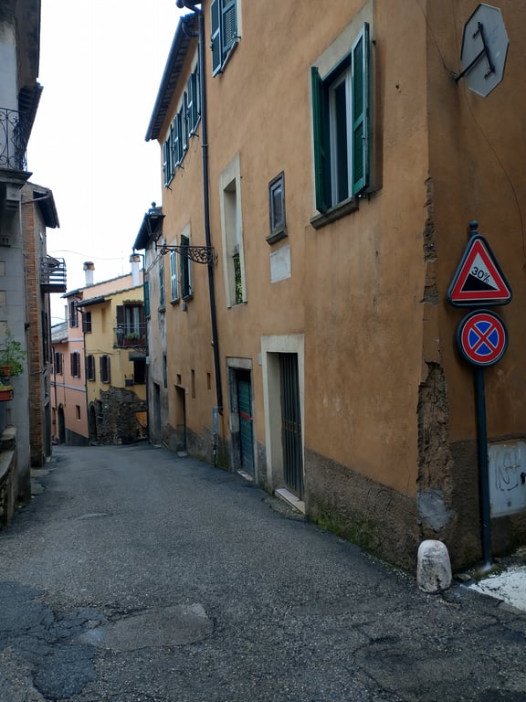 A road with a sign indicating a 30% grade