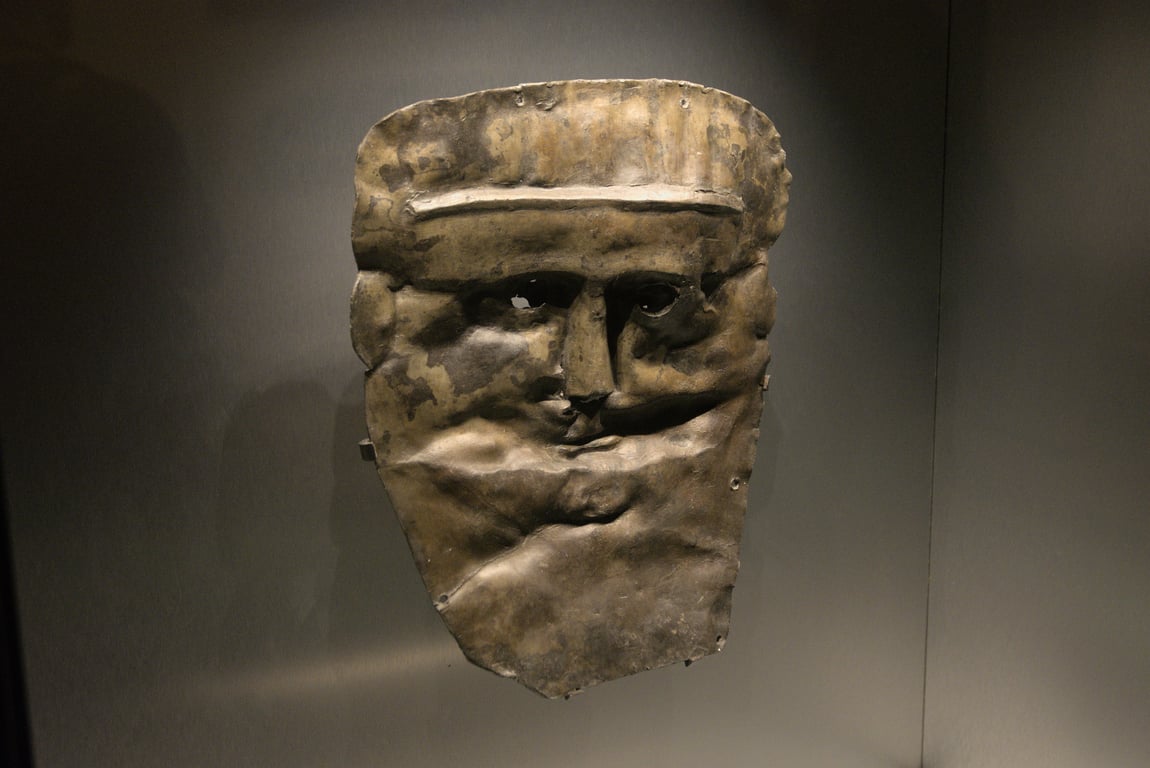 The remains of a mask, now completely flattened