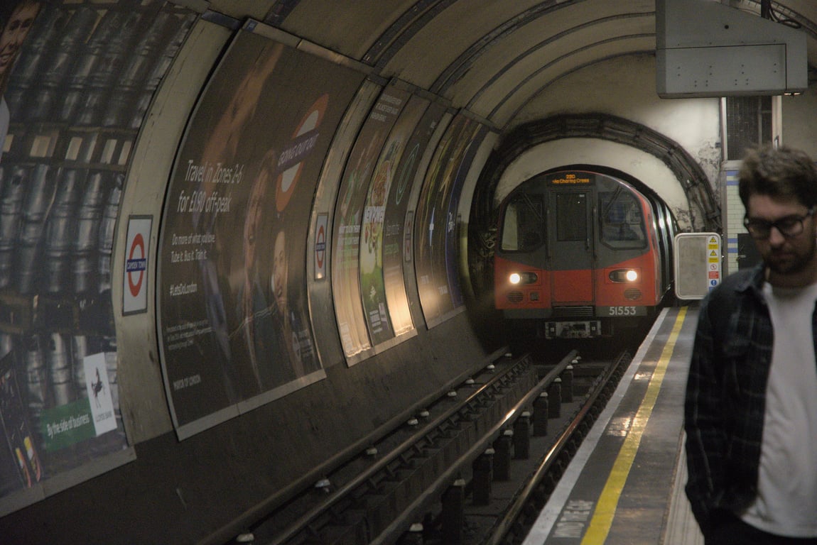 A train emerging from a tunnel in the London Underground.