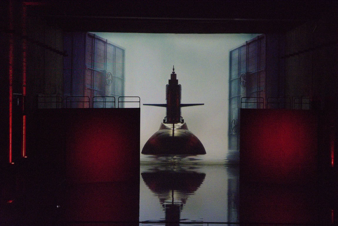 A projection of a submarine entering the base