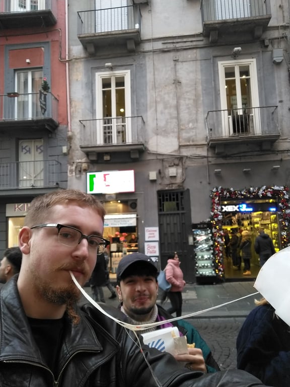 Me pulling a long string of cheese from my pizza portafoglio