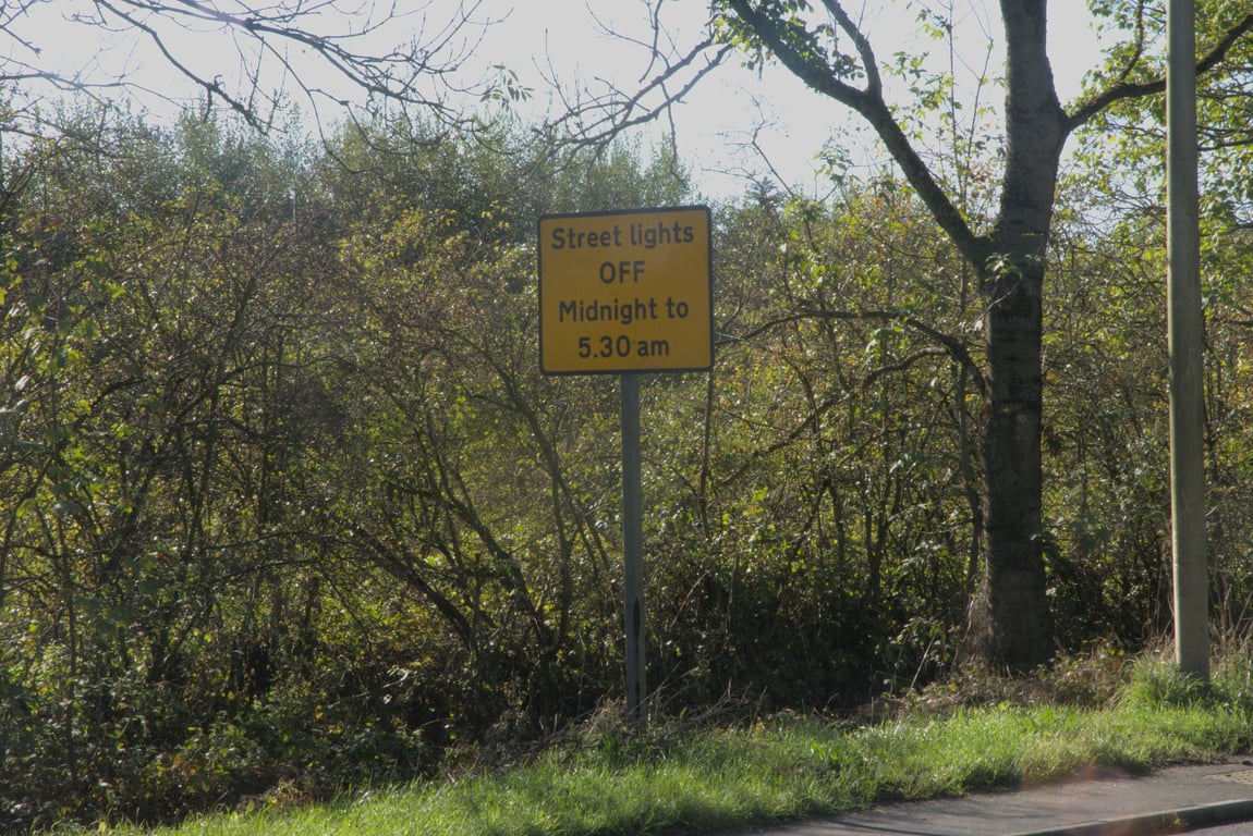 Roadsign: Streetlights OFF Midnight to 5.30am