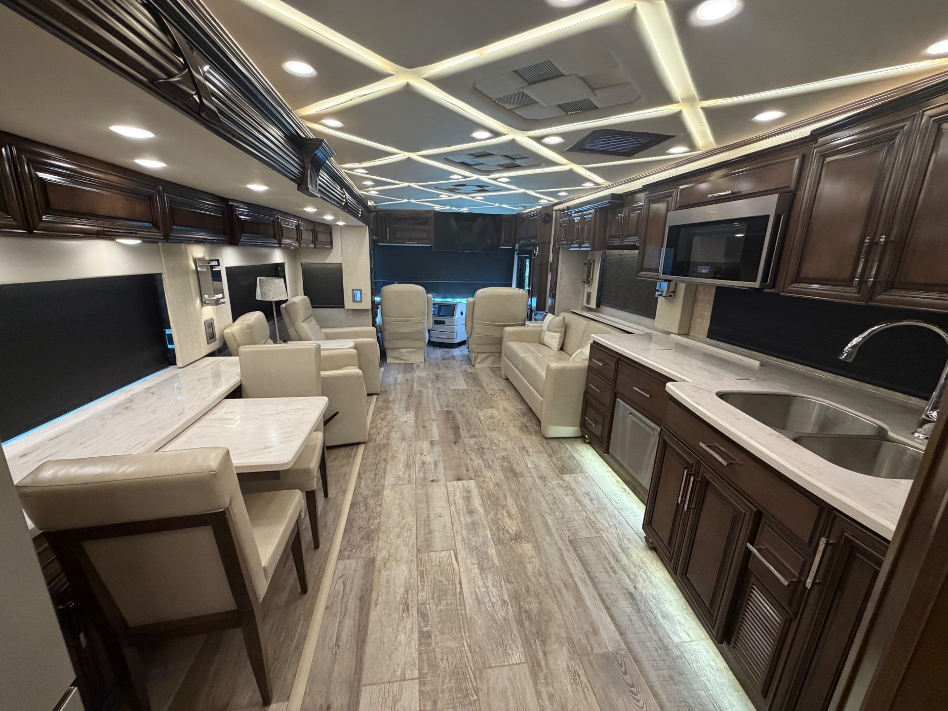 2020 Newmar Mountain Aire 4551 — Class A motorhome overview with kitchen counters and sink, lounge seating, dinette, and cockpit visible