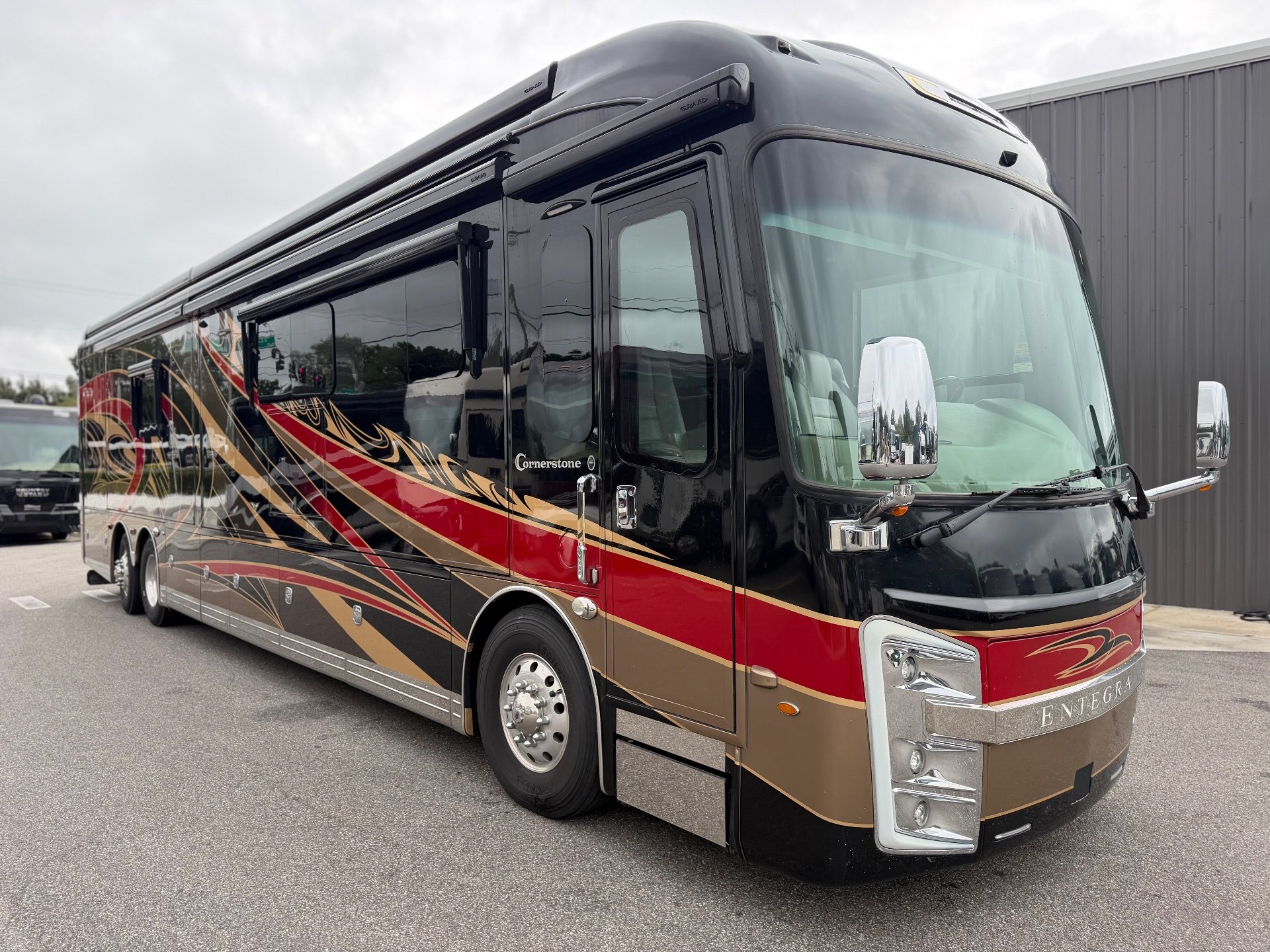 2021 Entegra Coach Cornerstone 45F — The front and side exterior shell of the Entegra Cornerstone motorhome