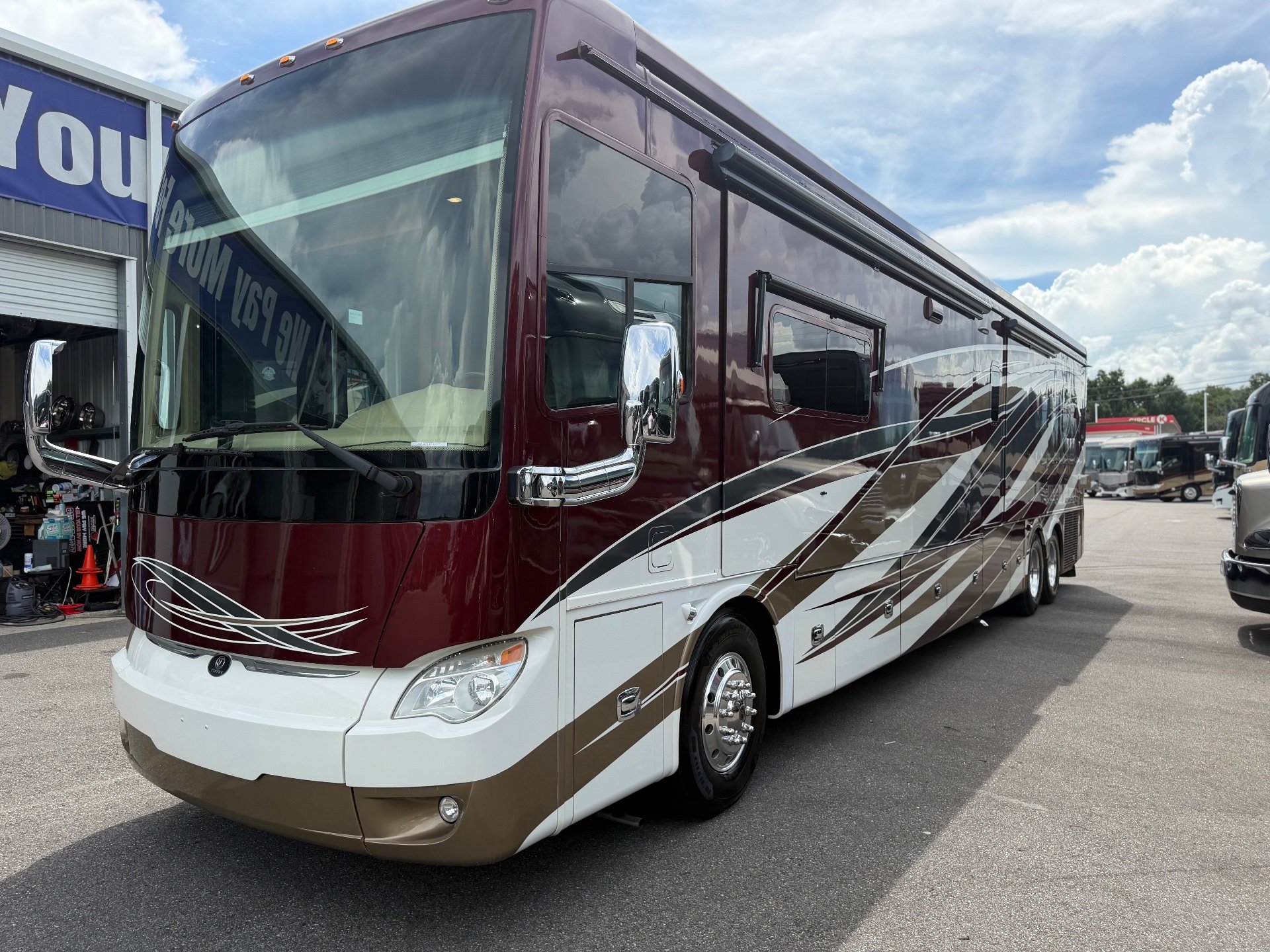 2017 Tiffin Allegro Bus 45 OPP — The motorhome's front and passenger-side exterior with awnings and body panels