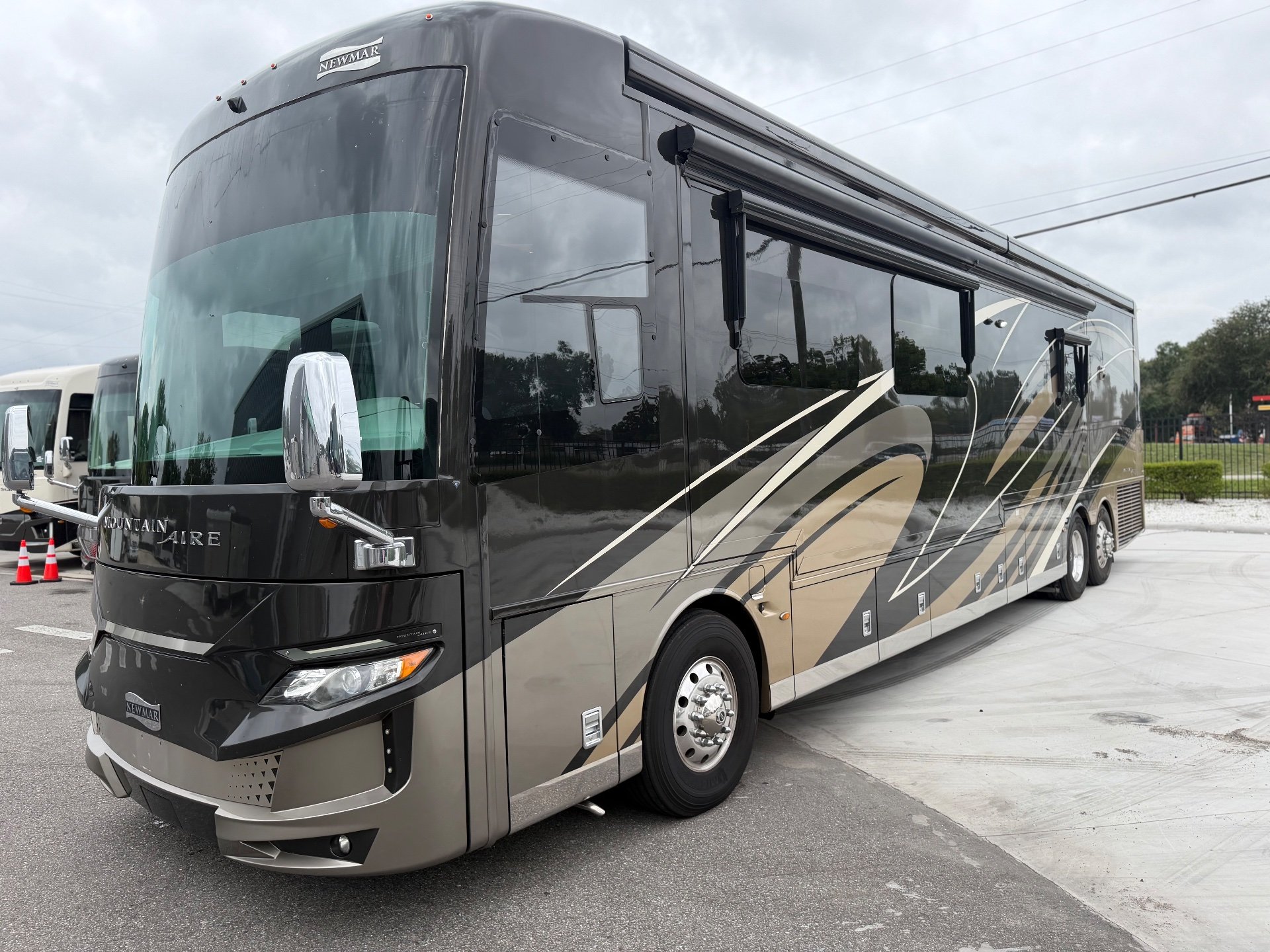 2020 Newmar Mountain Aire 4551 — The front and side exterior body, awnings, graphics, wheels, and exterior compartments