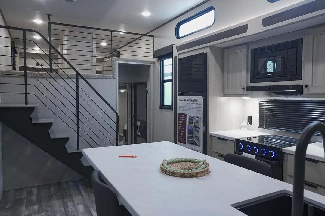 Loft with residential-style stairs in the Forest River Cardinal 38BET