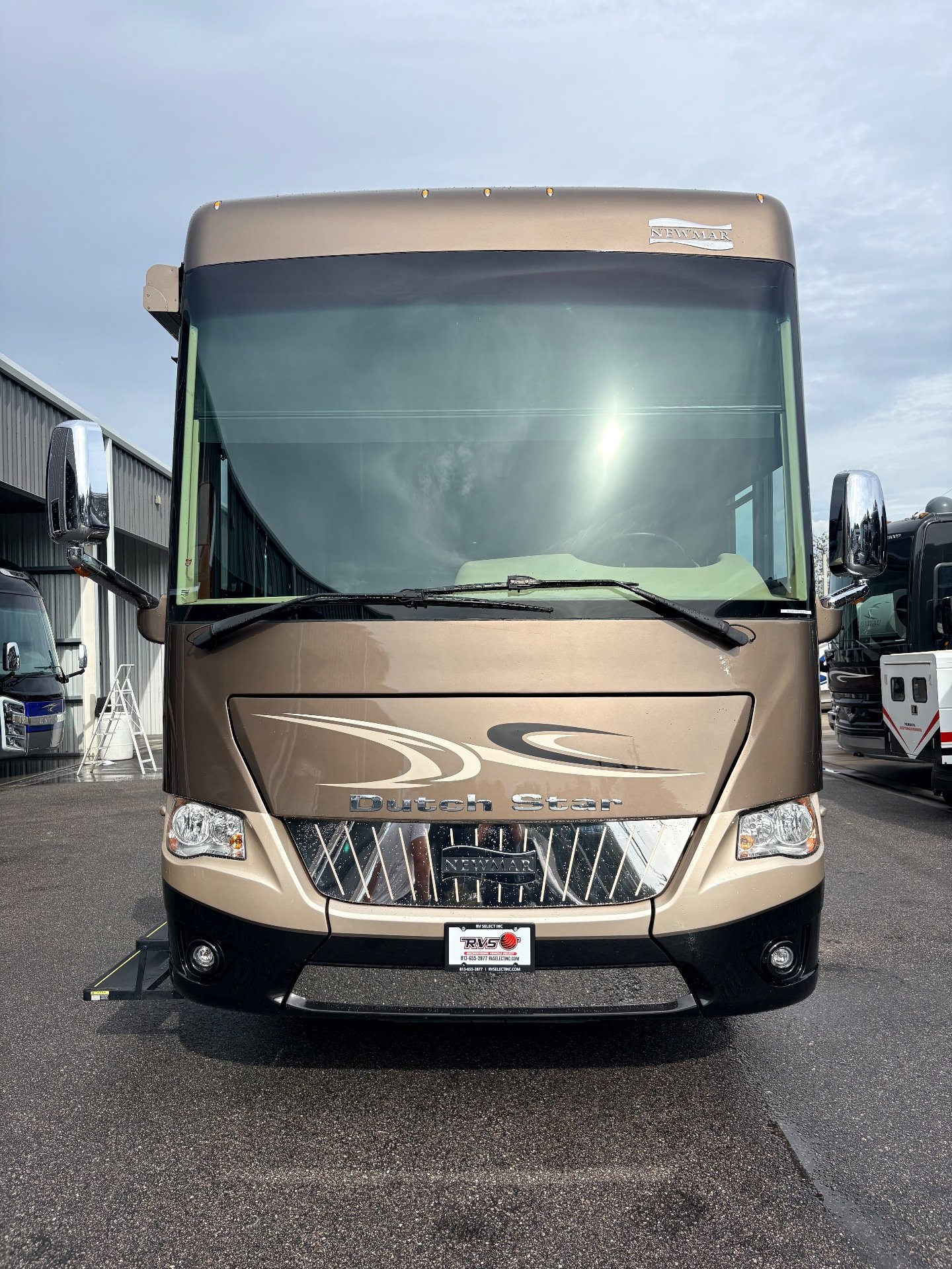 2017 Newmar Dutch Star 4369 — Front-facing photograph visibly shows the motorhome's exterior front cap, windshield, grille, lights, and mirrors