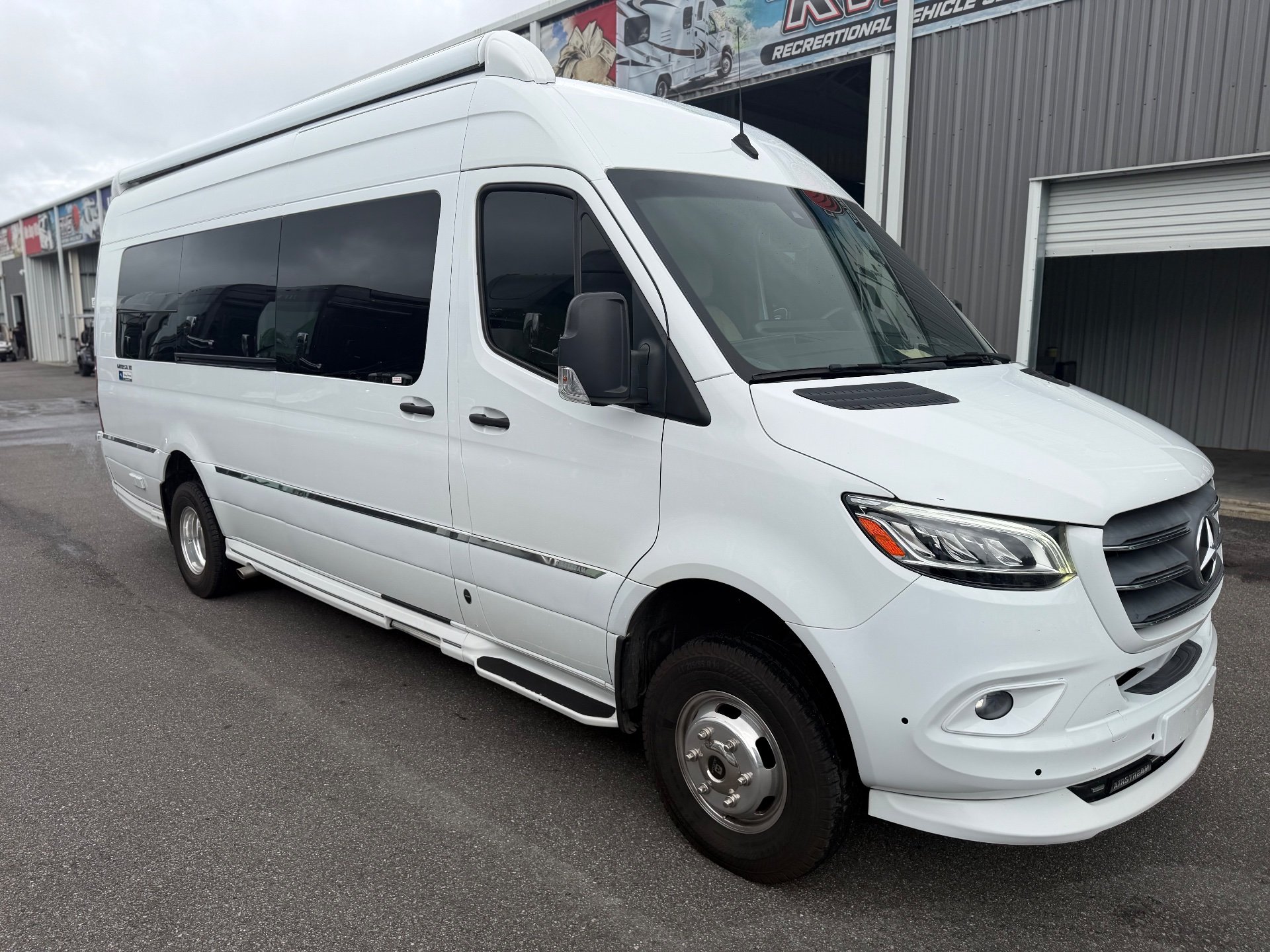 2020 Airstream Interstate 24GL 4WD — The outside front and side of the white RV